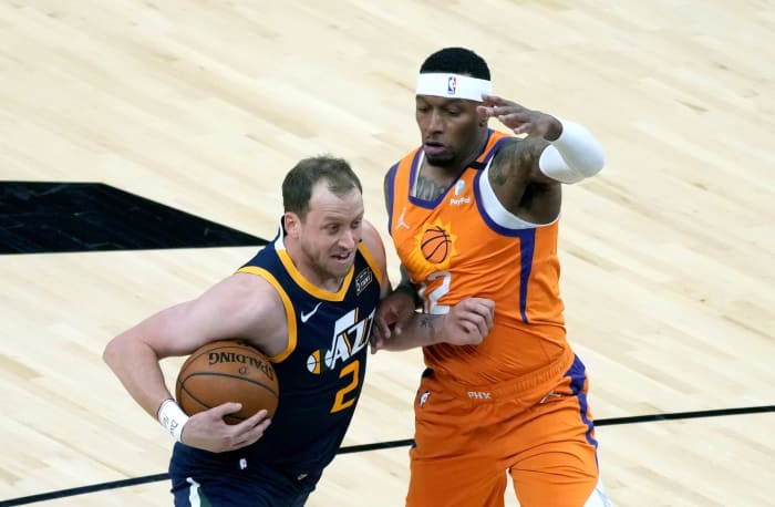 Joe Ingles (2) jostles for positioning against the Phoenix Suns